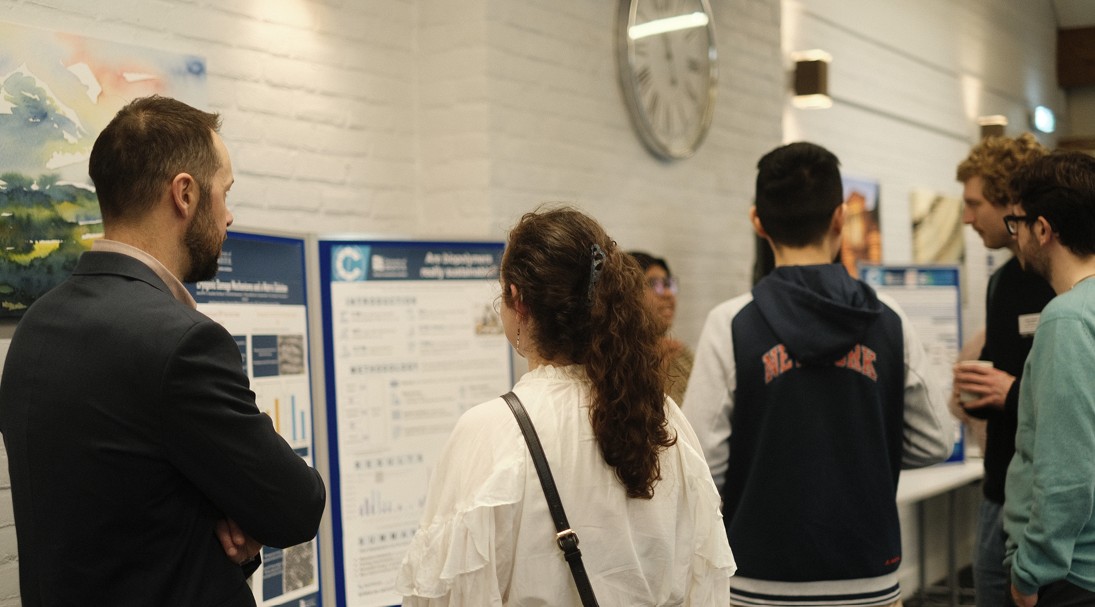 People reading academic posters